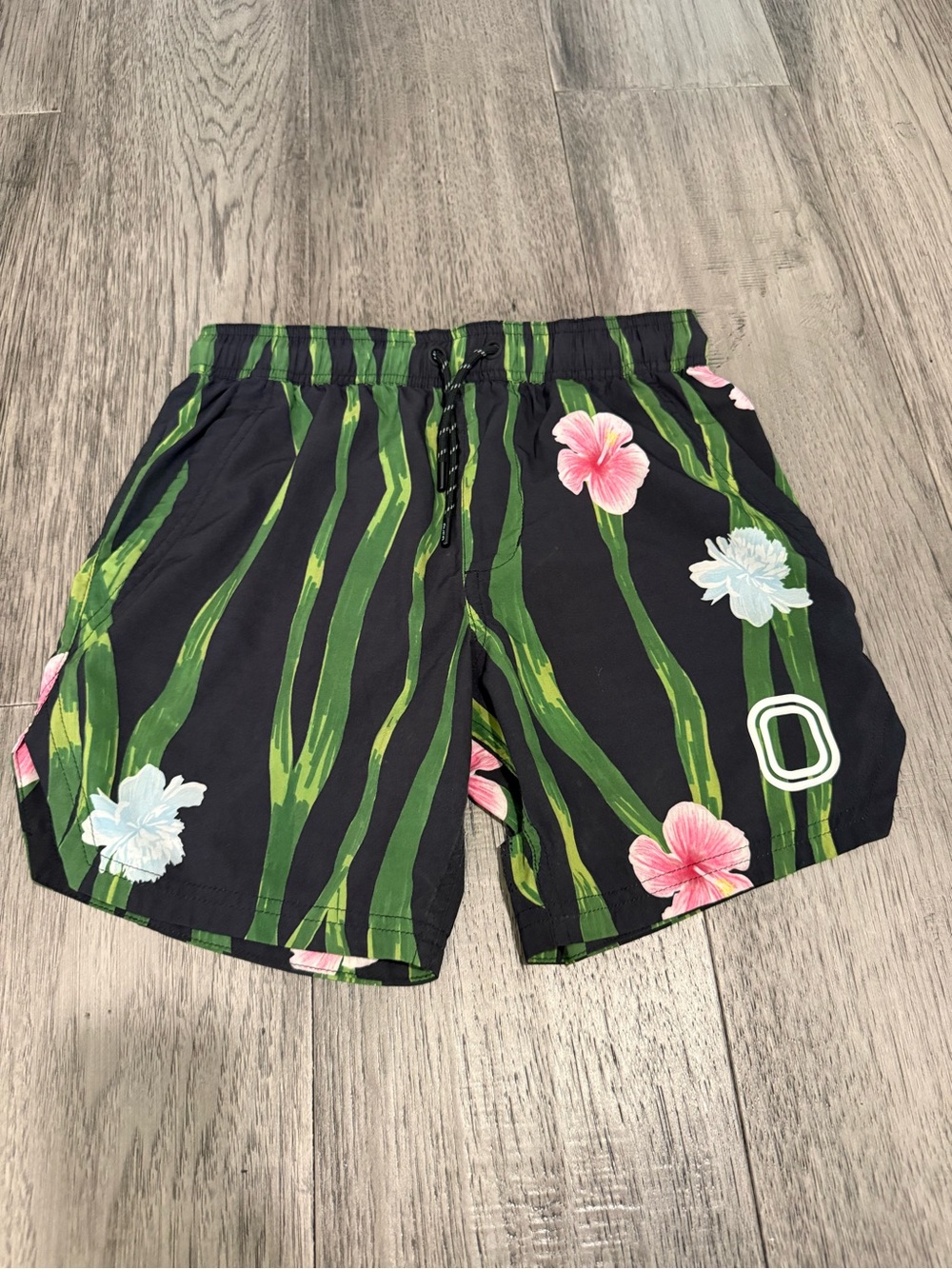 Kids Black Floral Swim Shorts with Green Stripe Detail